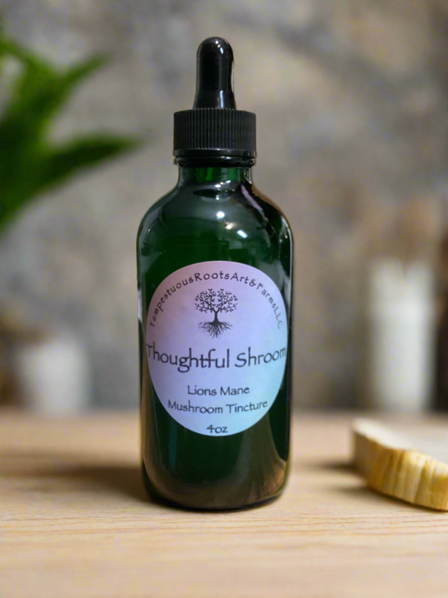 4 oz vottle of 'Thoughtful Shroom' Lions Mane mushroom tincture on a wooden surface with a blurred background